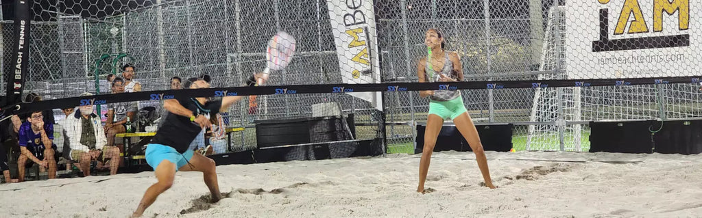 Beach Tennis gear at iambt/iambeachtennis :  Two pro players on a beach tennis court.