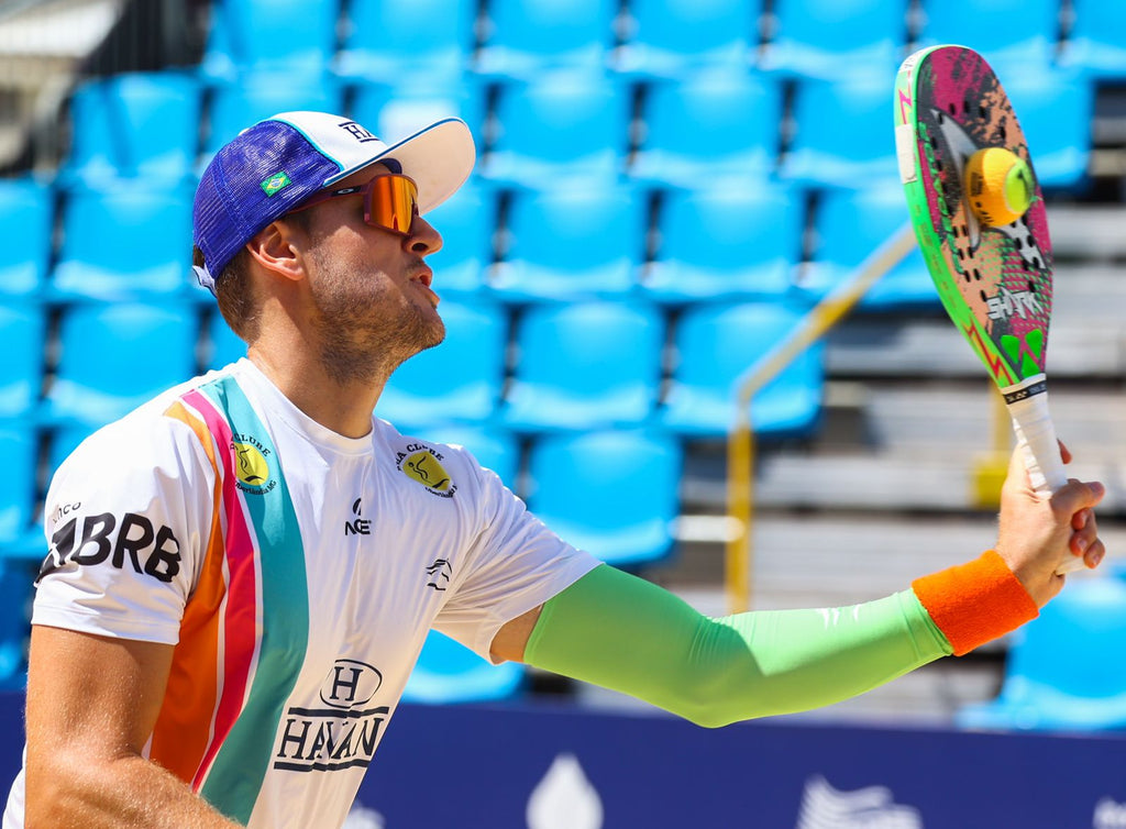 Andre Beran playing beach tennis with the new Shark Predator Beach Tennis Paddle he was integral in designing.