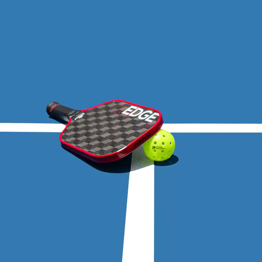 SPORT: PICKLEBALL. Shop Diadem Sports Pickleball at "iamPickleball.Store" a division of "iamracketsports.com". Racket model is a 2023 Diadem Edge 18K advanced/professional Pickleball Paddle. Paddle is in vertical position. Paddle and ball on court.