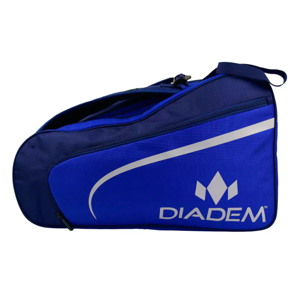 SPORT:PICKLEBALL. Shop Diadem at "iamracketsports.com", world wide shipping. Side view of Diadem Tour ELEVATE V3 Pickleball Paddle Bag, 3 paddle compartments, shoe compartment, side pockets, made from high quality nylon with adjustable handles, dimensions 21"x11"*12", color navy/blue and white.