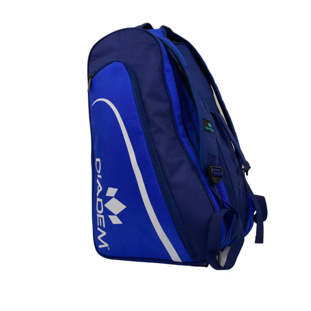 Shop Diadem Bags at at "iamPickleball.store" boutique Depot Store.Diadem Tour ELEVATE V3 Pickleball Paddle Bag, 3 paddle compartments, shoe compartment, side pockets, made from high quality nylon with adjustable handles, dimensions 21"x11"*12", Color navy/blue and white.