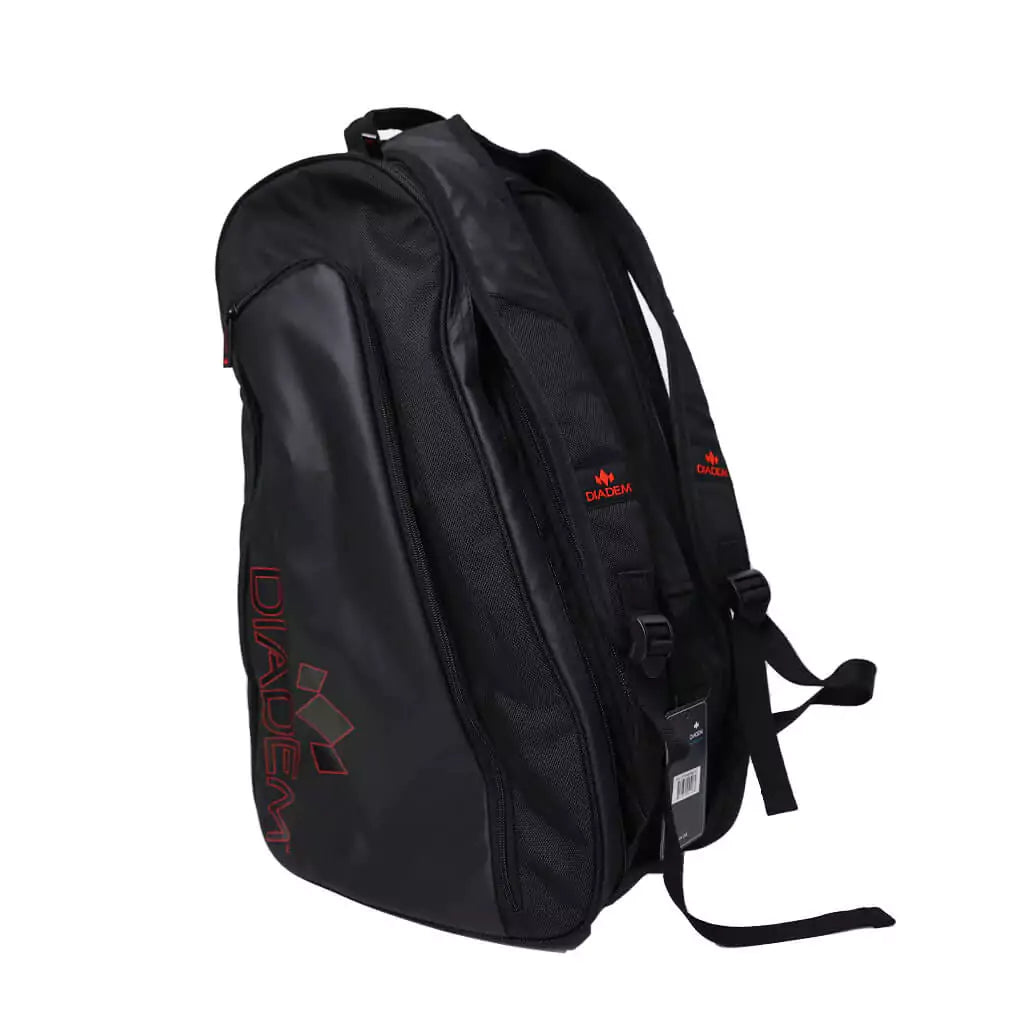 Shop Diadem Bags at at "iamPickleball.store" boutique Depot Store - Bag model is Diadem Tour Black V2 Paddle backpack, bag in black with red trim, 3 paddle compartments, shoe compartment,  side pockets, made from high quality nylon with adjustable handles.