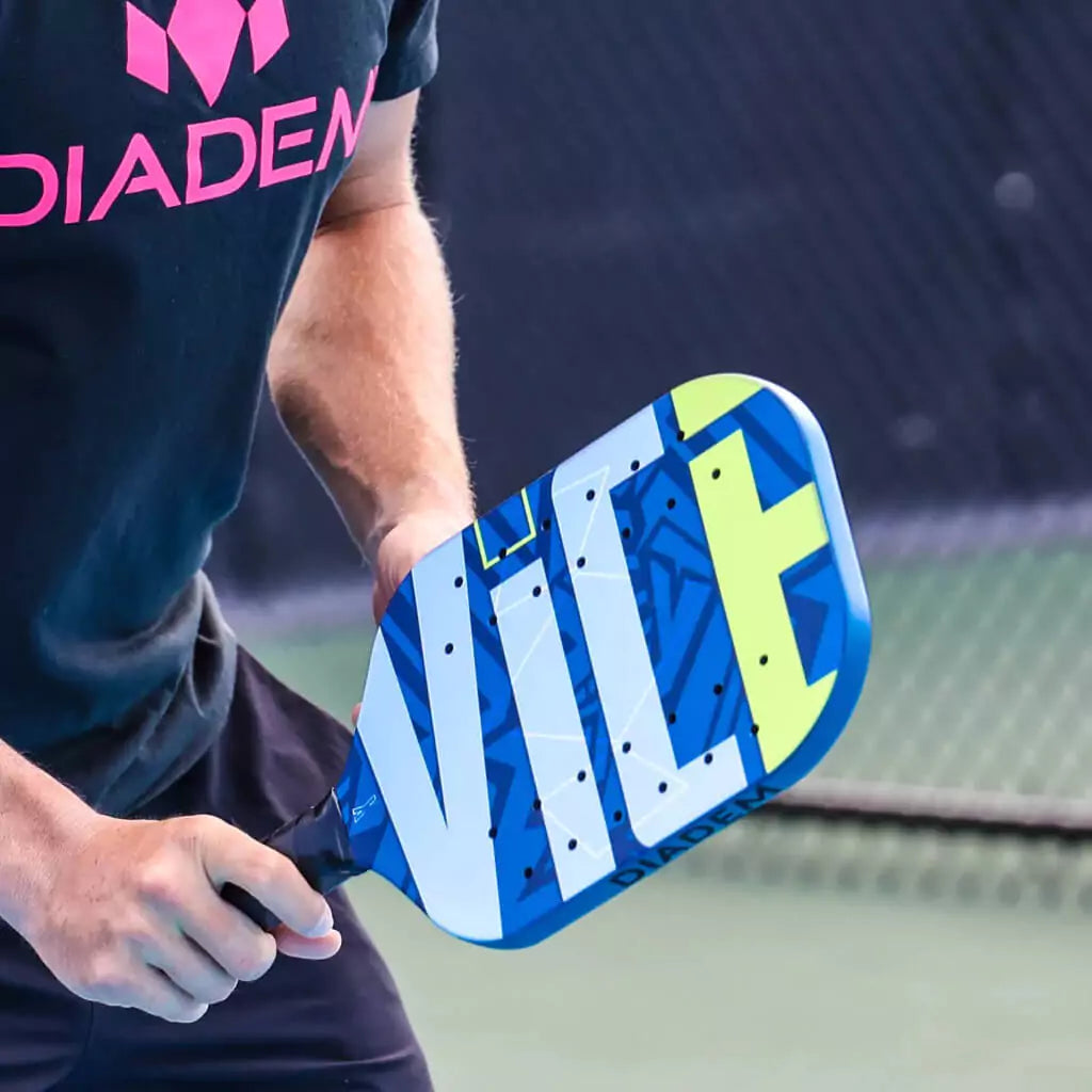 "iamPickleball.store" boutique Depot Store. Player holding Diadem Sports VICE 2023 Professional Pickleball Paddle on pickleball court.