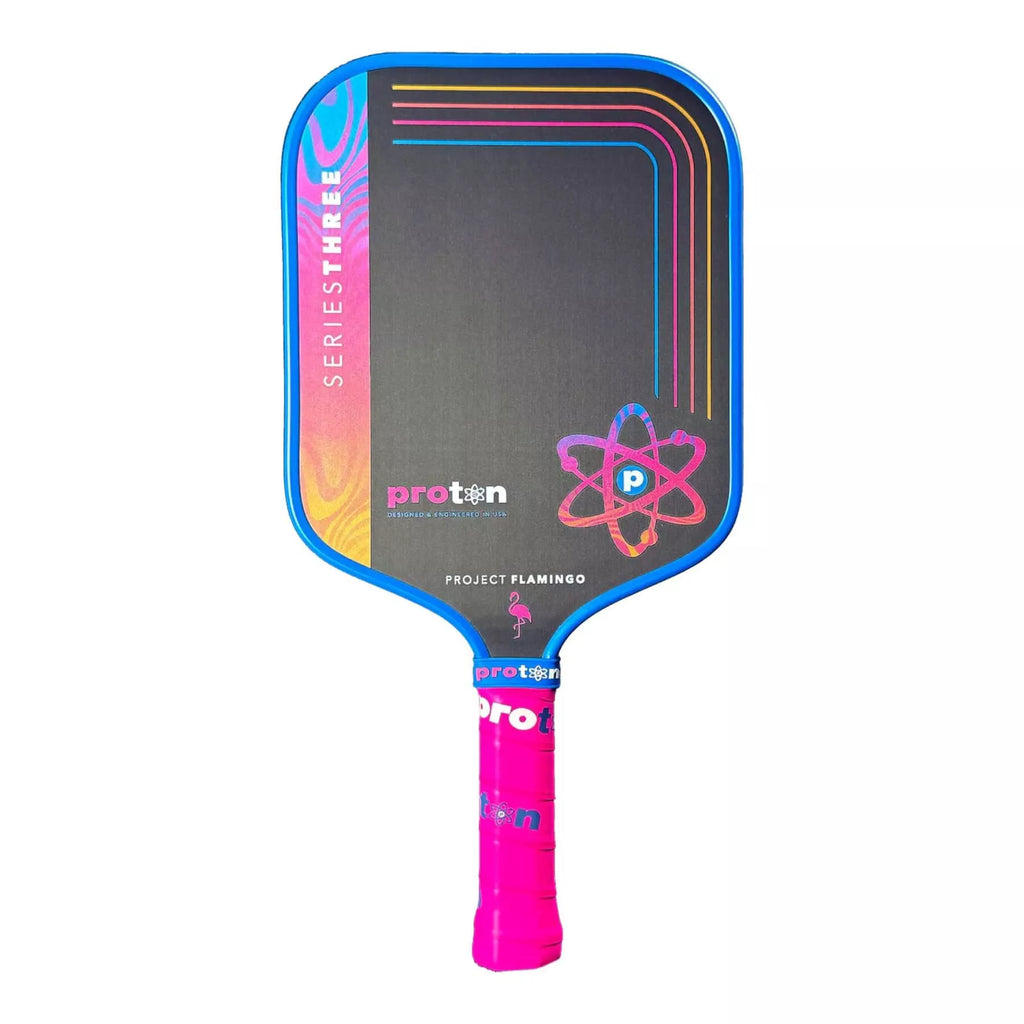 A Proton Series Three - Project Flamingo Widebody (Square) 13 mm Pickleball Paddle with blue edge guard, available from IamRacketsports.com, online and in-store, Miami USA, worldwide shipping.