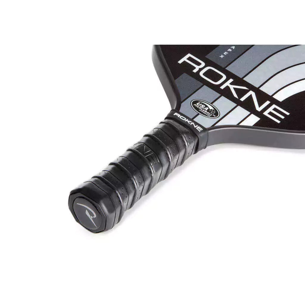 SPORT: PICKLEBALL. Shop Rokne Pickleball at iambeachtennis maimi Racket and Paddle Sports store. Racket model is a 2023 Rokne Curve Apex STORM Pickleball Paddle/racket for beginner and intermediate players. Neck and handle view of Racquet/Paleta.