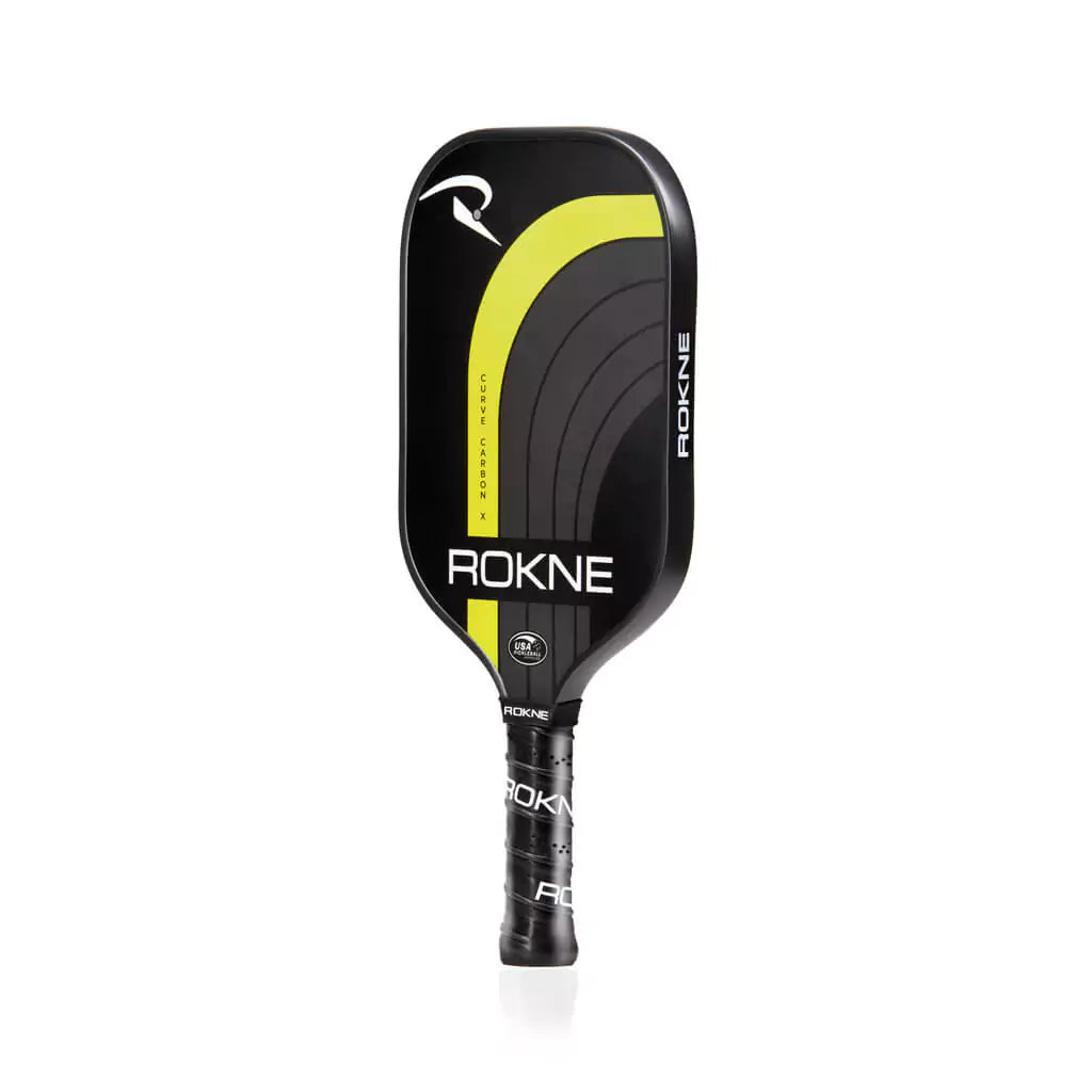 SPORT: PICKLEBALL. Shop Pickleball Paddles and Rackets at "iam-Pickleball.com" a division of "iamracketsports.com". Racket model is a 2023 Rokne Curve Carbon x LIGHTNING  Pickleball Paddle/racket for advanced and professional players. Racquet/Paleta is in side vertical orientation.