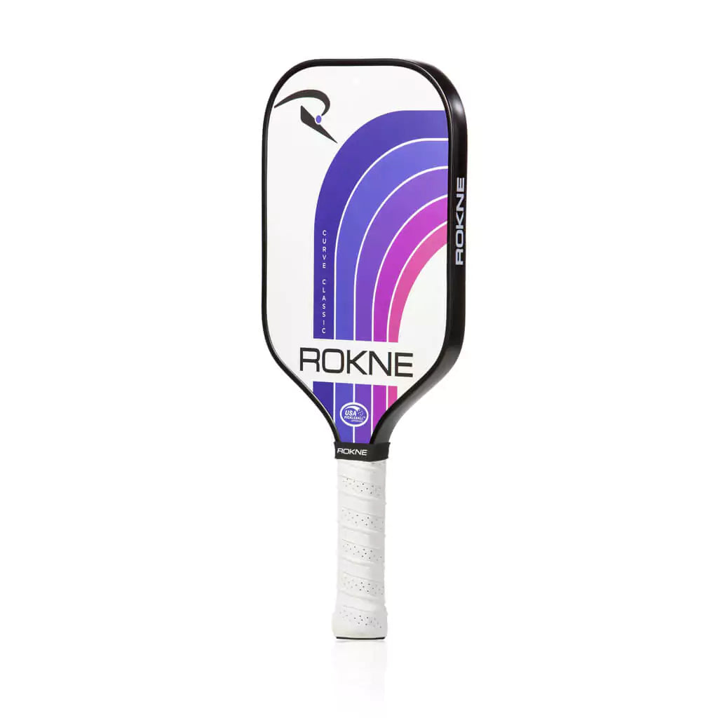 SPORT: PICKLEBALL. Shop Pickleball Paddles and Rackets at "iam-Pickleball.com" a division of "iamracketsports.com". Racket model is a 2023 Rokne Curve Classic NORTHERN SKY  Pickleball Paddle/racket for beginner and intermediate players. Racquet/Paleta is in side vertical orientation.
