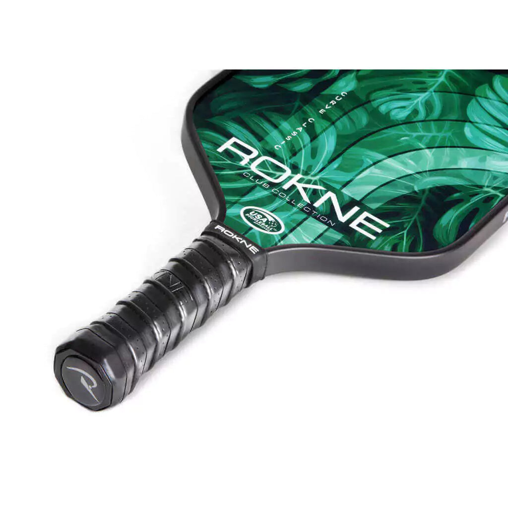 SPORT: PICKLEBALL. Shop Rokne Pickleball at iambeachtennis maimi Racket and Paddle Sports store. Racket model is a 2023 Rokne Curve Classic Club Collection PALM Pickleball Paddle/racket for beginner and intermediate players. Neck and handle view of Racquet/Paleta.