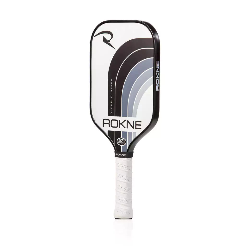 SPORT: PICKLEBALL. Shop Pickleball Paddles and Rackets at "iam-Pickleball.com" a division of "iamracketsports.com". Racket model is a 2023 Rokne Curve Classic STORM  Pickleball Paddle/racket for beginner and intermediate players. Racquet/Paleta is in side vertical orientation.