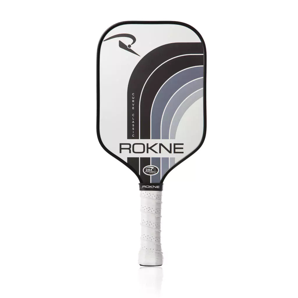 SPORT: PICKLEBALL. Shop Rokne Pickleball at USA premier Racket and Paddle Sports store, "iamracketsports". Racket model is a 2023 Rokne Curve Classic STORM Pickleball Paddle/racket for beginner and intermediate players. Racquet/Paleta is in vertical orientation.