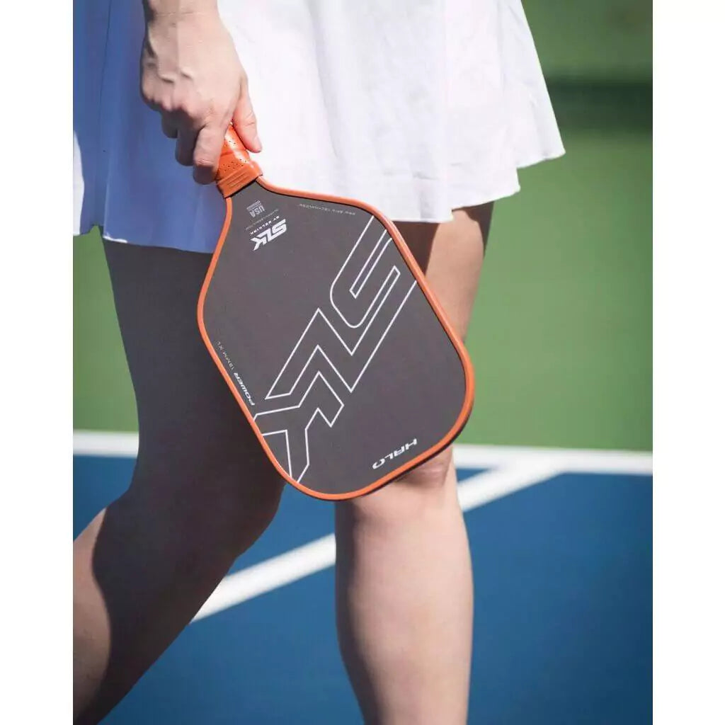 SPORT: PICKLEBALL. Shop Selkirk Sports Pickleball at USA premier Racket and Paddle Sports store, "iamracketsports". Racket model is a 2023 Selkirk SLK HALO CONTROL MAX Pickleball Paddle/racket for professionals and advanced players. Female player using paddle.