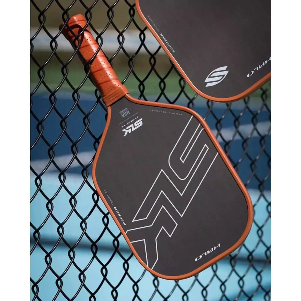 SPORT: PICKLEBALL. Shop Selkirk Sports Pickleball at USA premier Racket and Paddle Sports store, "iamracketsports". Racket model is a 2023 Selkirk SLK HALO CONTROL XL Pickleball Paddle/racket for professionals and advanced players. Paddle on fence.