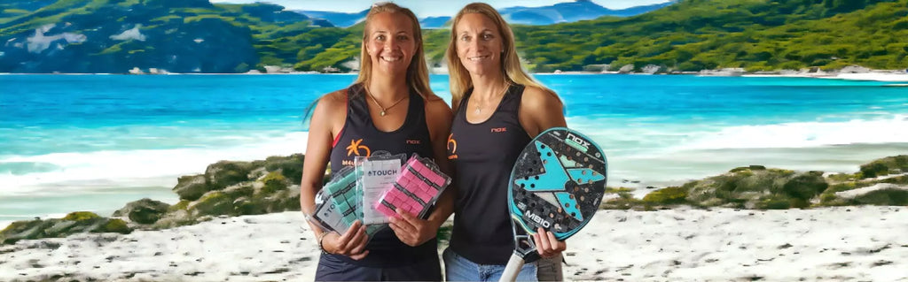 BT4U brand (Beach Tennis For You).  Image shows pro beach tennis players Maraike Biglmaier and Margie Pelster holding BT4U Touch Super Grips-and nox racket/paddle on a beach