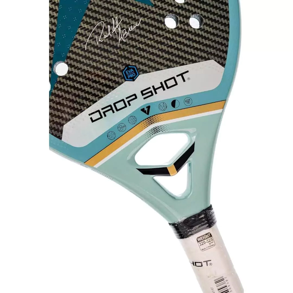 A Ralff Abrec signature Drop Shot POWER PRO 4.0 BT 2024 Beach Tennis Paddle, iamRacketSports.com store stocked product. A partially displayed paddle face.