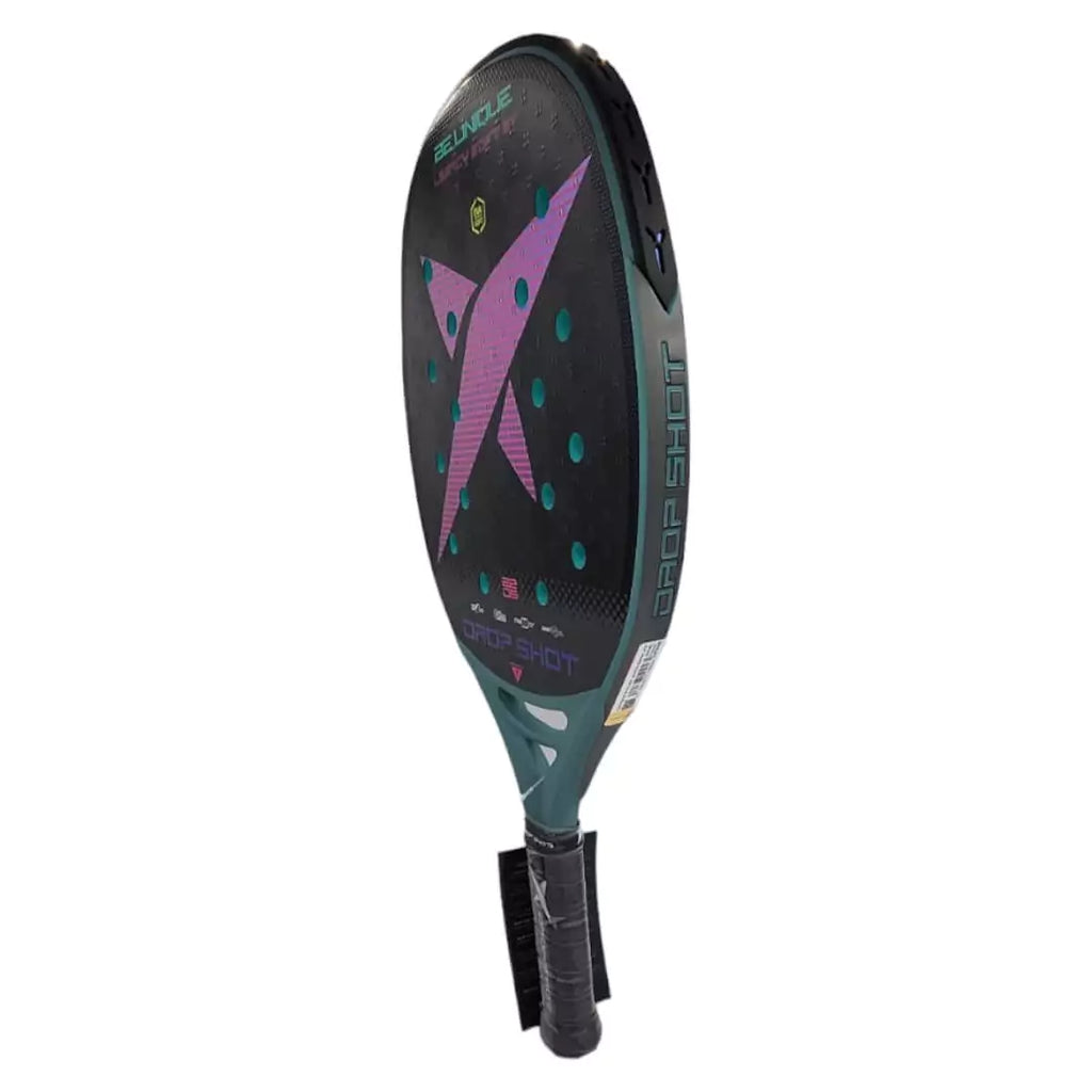 SPORT:BEACH TENNIS.  Shop Dropshot at "iamracketsports.com" Miami's Beach Tennis center. Racket model is a  Drop Shot Legacy Pro Soft 2023 BT Professional Beach Tennis Paddle/racket  for advanced and professional players.  Racquet/Paleta standing vertically rotated left to show face and head edge protector. 