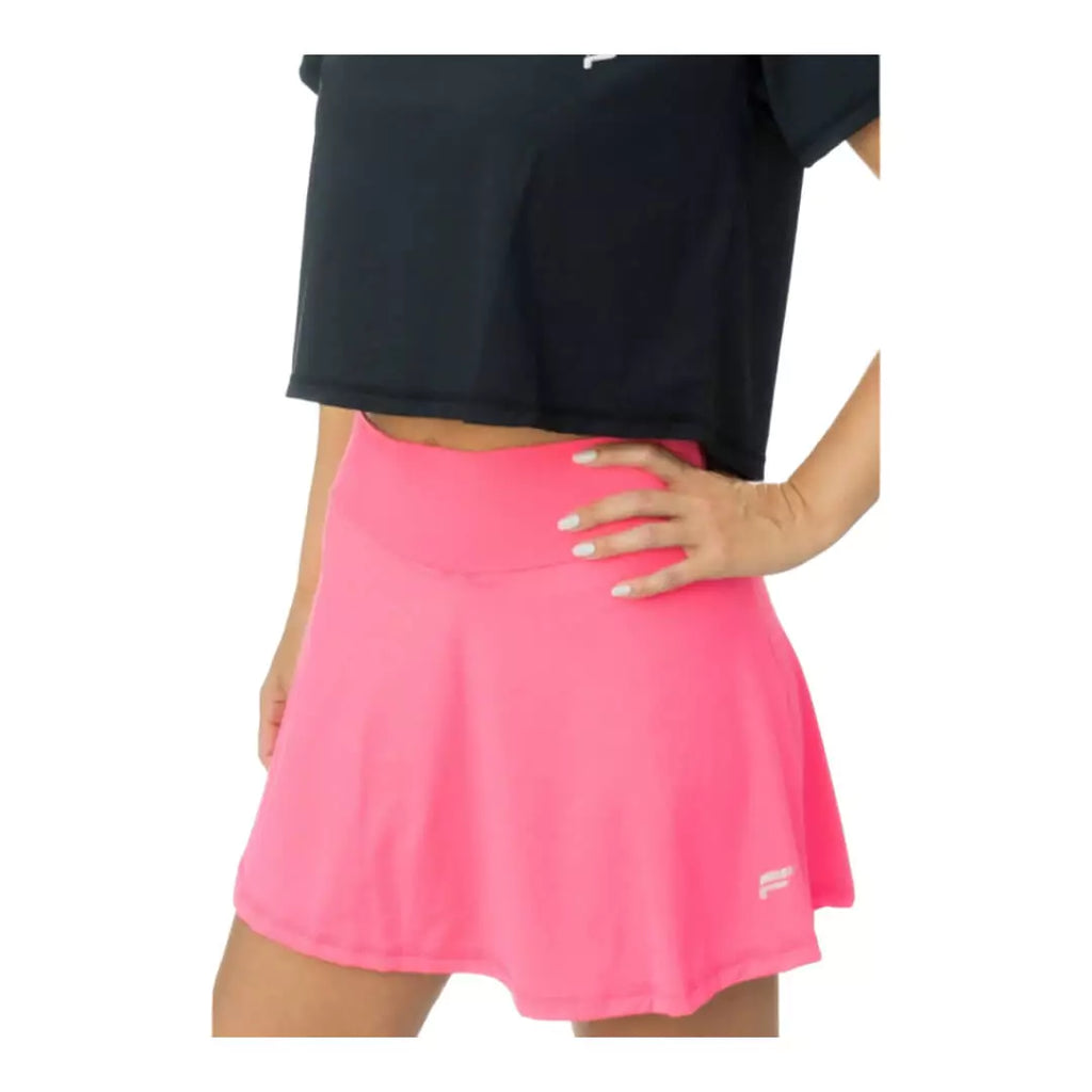 SPORT:BEACH TENNIS. Shop Flow Beach tennis at iamBeachTennis Depot Store. Female model, turned sideways wearing a pink Flow Beach Tennis LAGUNA Beach Tennis Skirt.