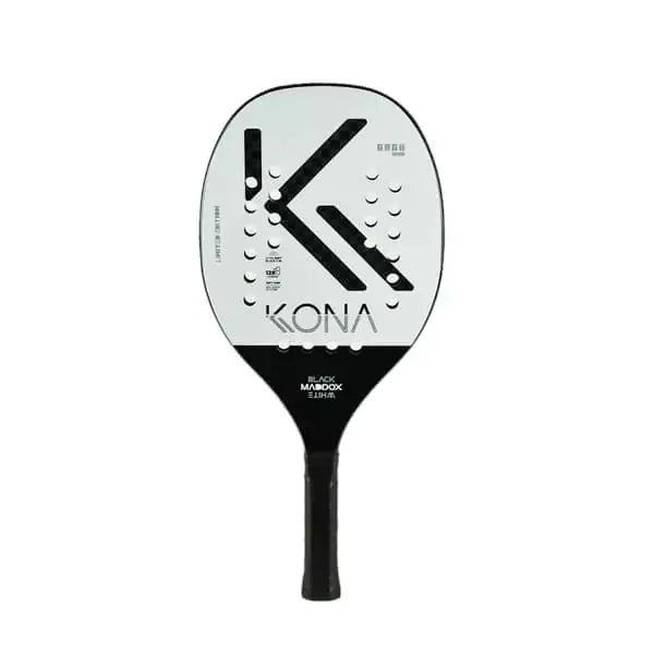 A Kona MADDOX BLACK AND WHITE 2024 Beach Tennis Racket with Carbon 12K, Kelvar surface, Eva Extra Soft core, 20mm thick. Shop Kona at iamBeachTennis.com Miami store.
