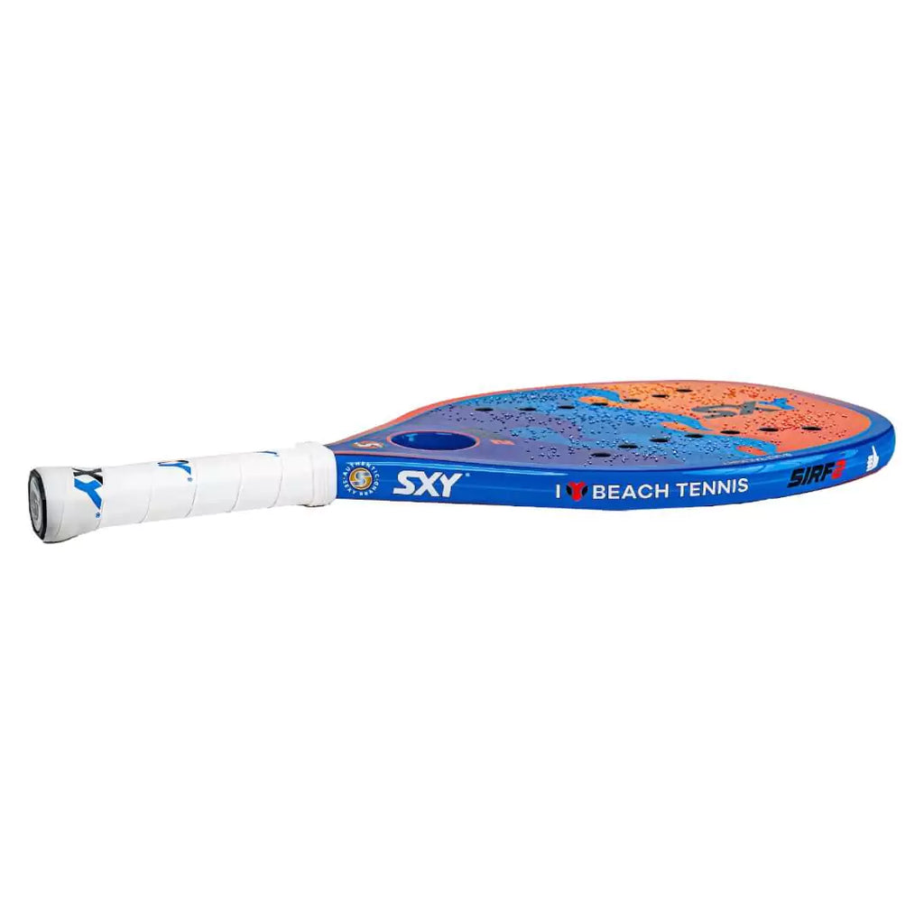 SPORT:BEACHTENNIS. Shop Sxy Brand at iamRacketSports.com Colisium Store. SXY THE BLUE SIRF 2 2024 Beach Tennis Racchetta/Paddle, beginner to advanced level player, lying flat.