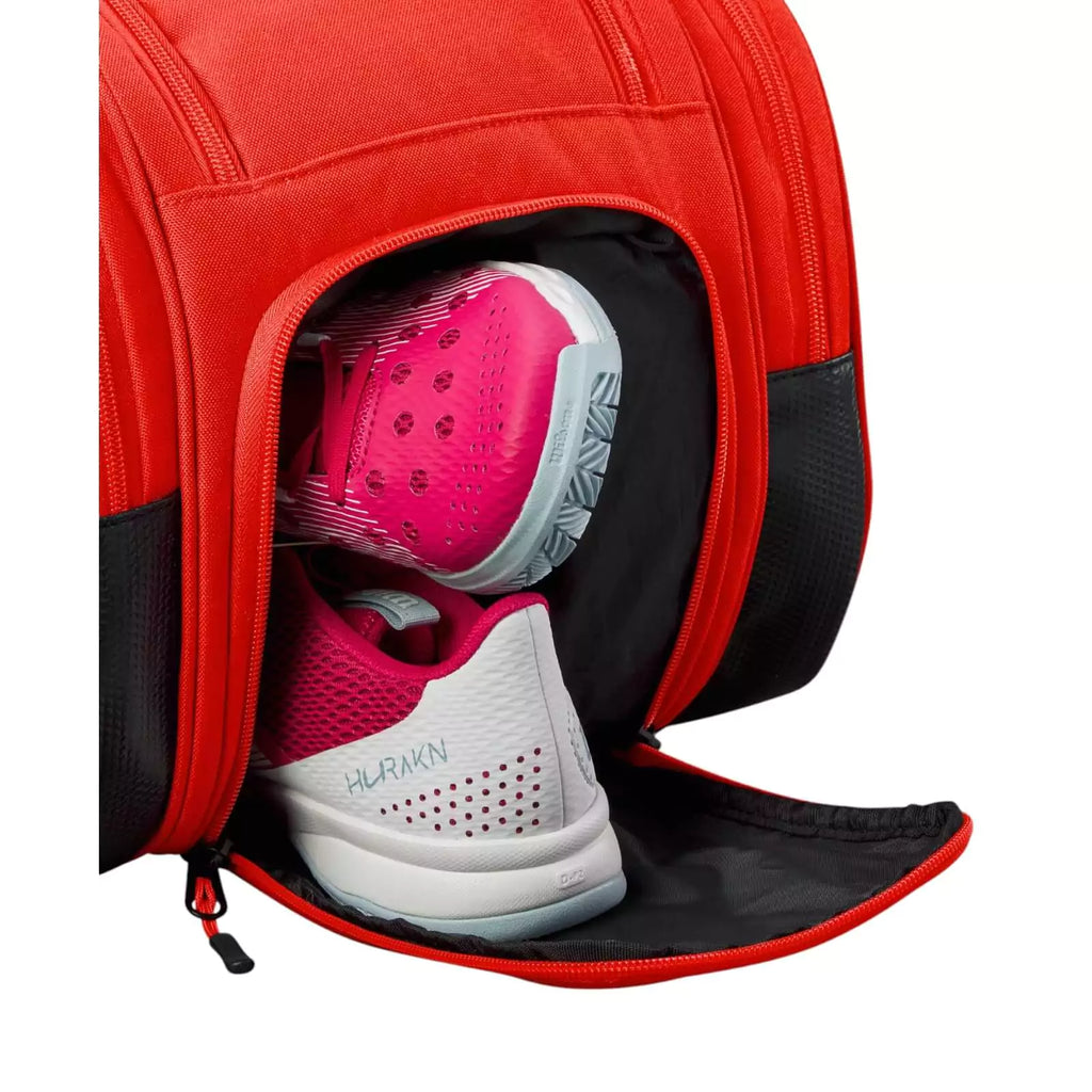 Open shoe compartment of a Wilson Tour Red Padel Bag, available from iamRacketSports.com, online and in store, world wide shipping.