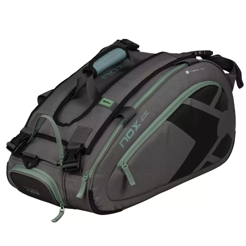 A gray and green, Nox AT10 TEAM Padel Racket Bag, available from "iamracketsports.com", Miami shop.