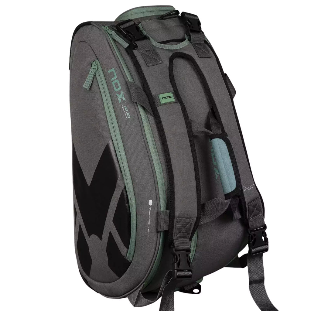 A gray and green, Nox AT10 TEAM Padel Racket Bag, available from "iamracketsports.com", Miami shop.