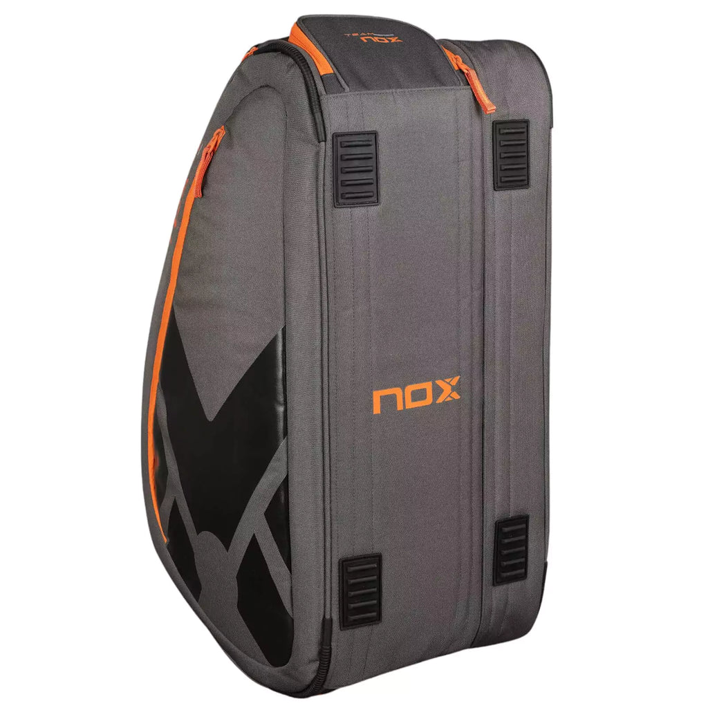 A standing Nox AT10 TEAM Padel Racket Bag, available from "iamracketsports.com", Miami shop.