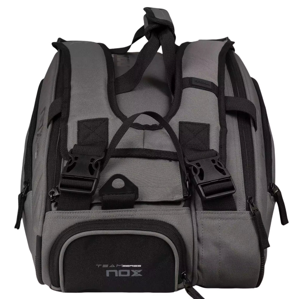 A gray and black, Nox AT10 TEAM Padel Racket Bag, available from "iamracketsports.com", Miami shop.