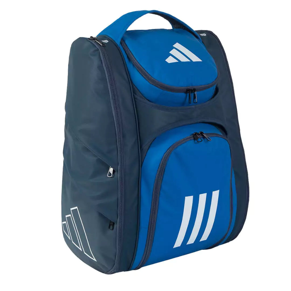 Shop Adidas Bags at iamBeachTennis, world wide shipping Adidas RACQUET BAG MULTIGAME 3.2 in synthetic leather with two side pockets for rackets / racquets, separate pocket for clothing and shoe compartment. Padded shoulder straps. Front and side profile, navy with blue compartment front pockets.
