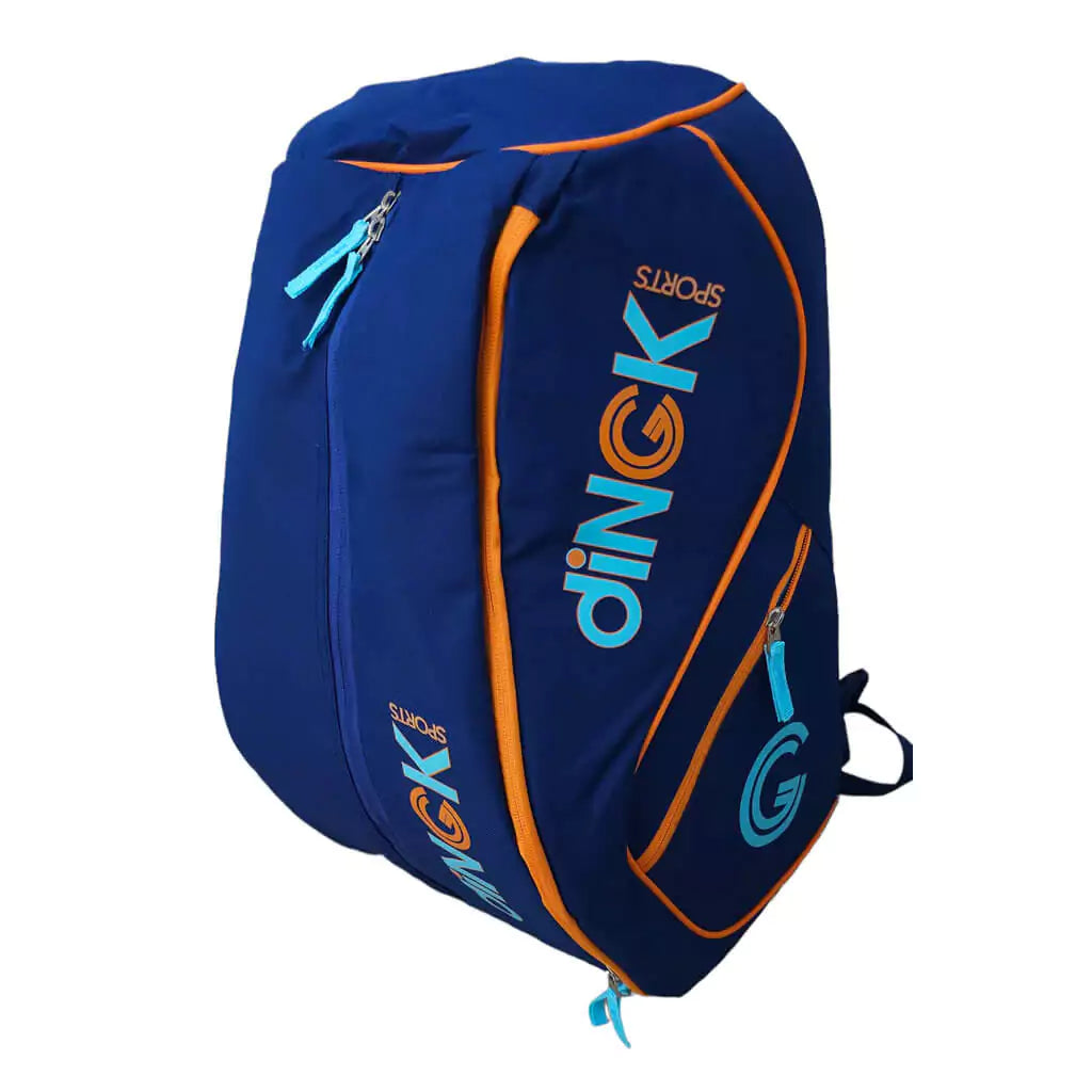 SPORT: PICKLEBALL. Shop DiNGK Sports Pickleball at USA premier Racket and Paddle Sports store, "iamracketsports". Bag model is a 2023 DiNGK Pickleball PRO TOUR RACQUEST BAG in blue. Backpack/bag is in vertical orientation facing left.