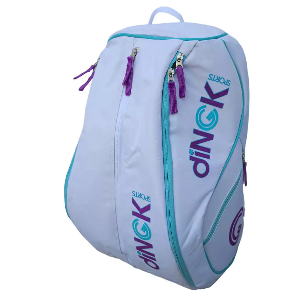 SPORT: PICKLEBALL. Shop DiNGK Sports Pickleball at USA premier Racket and Paddle Sports store, "iamracketsports". Bag model is a 2023 DiNGK Pickleball PRO TOUR RACQUEST BAG in white. Backpack/bag is in vertical orientation.