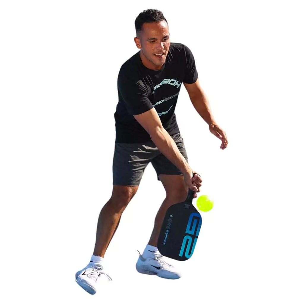 A player using a GearBox G2 Elongated Pickleball Paddle, available from iamracketsports.com, Miami store.