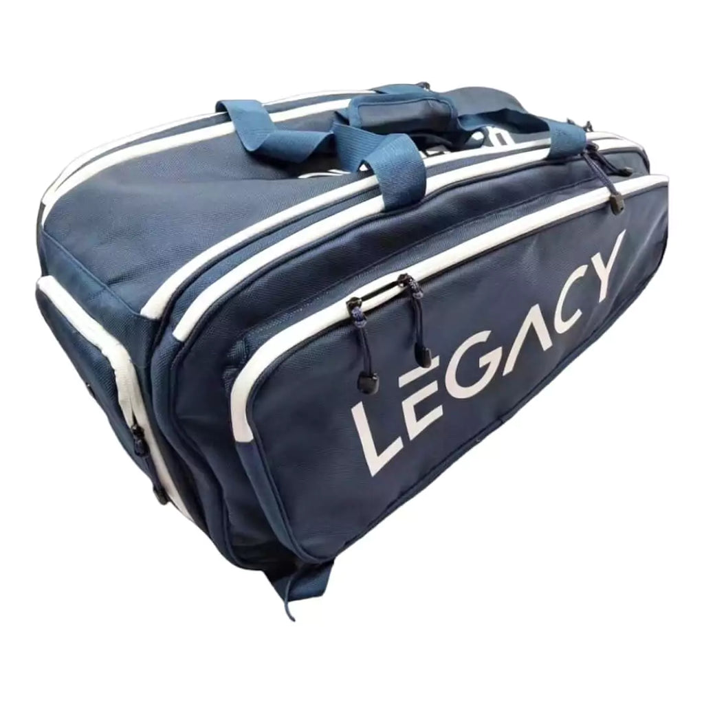 SPORT: PICKLEBALL. Shop Legacy pickleball paddles at iamRacketSports/iam-pickleball, Miami, Florida, USA. A side profile of navy Legacy Elite Tour Paddle Pickleball Bag with Two compartments for 4+ Paddles, Large Main ,two exterior zippered and a bottom Shoe compartment, backpack straps convertible to convert bag to a duffel style.