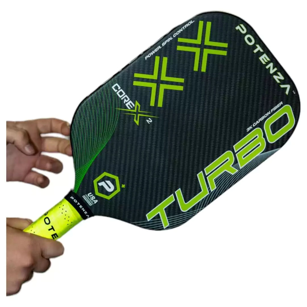 A player holding a Potenza TURBO+CORE*2 Pickleball Paddle, available at iamracketsports.com.