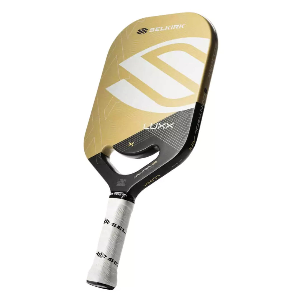 SPORT:PICKLEBALL. Vertical tilted , edge on profile of GOLD Selkirk LUXX CONTROL AIR EPIC Pickleball Paddle. Endorsed by Jack Sock,  features Thikset Honeycomb core, Florek Carbon  Surface, 20 mmm thick,  grip length 4.25, grip size 4.25", edgeless Aero-DuraEdge frame.