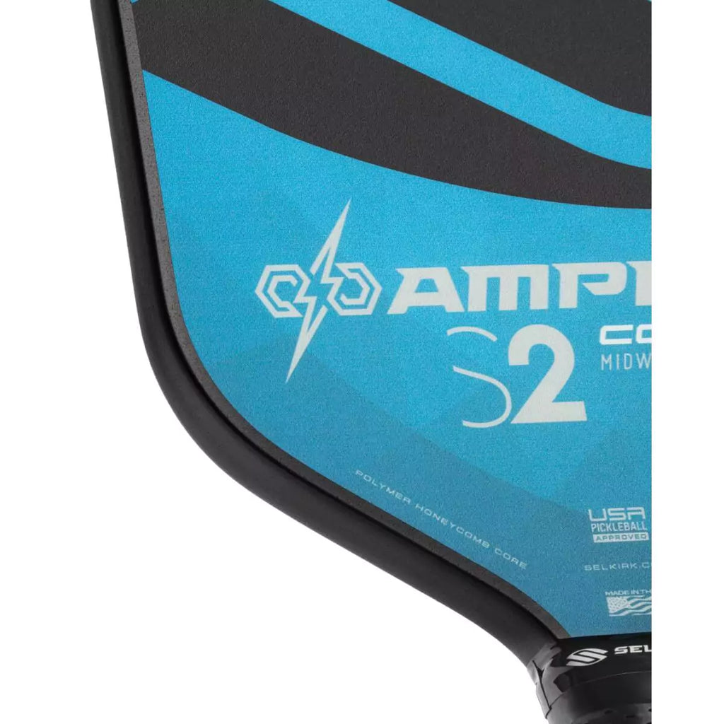 The bottom left corner of the face of a blue
Selkirk AMPED Control S2 16mm Pickleball Paddle,
FiberFlex + Fiberglass surface with 
a durable spin coating and X5 Honeycomb core.
Available from iamPickleball.store.