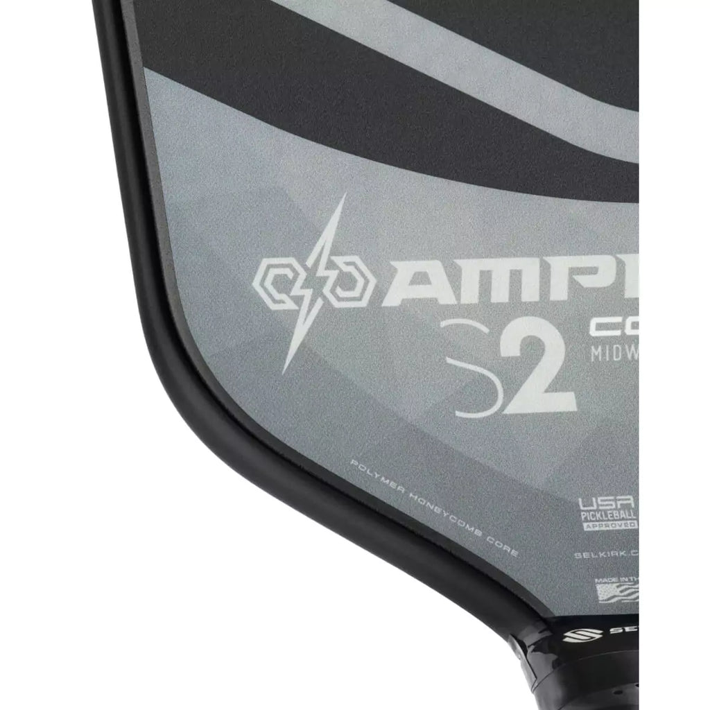 A lower section of the face of a gray 
Selkirk AMPED Control S2 16mm Pickleball Paddle,
FiberFlex + Fiberglass surface with 
a durable spin coating and X5 Honeycomb core.
Available from iamPickleball.store