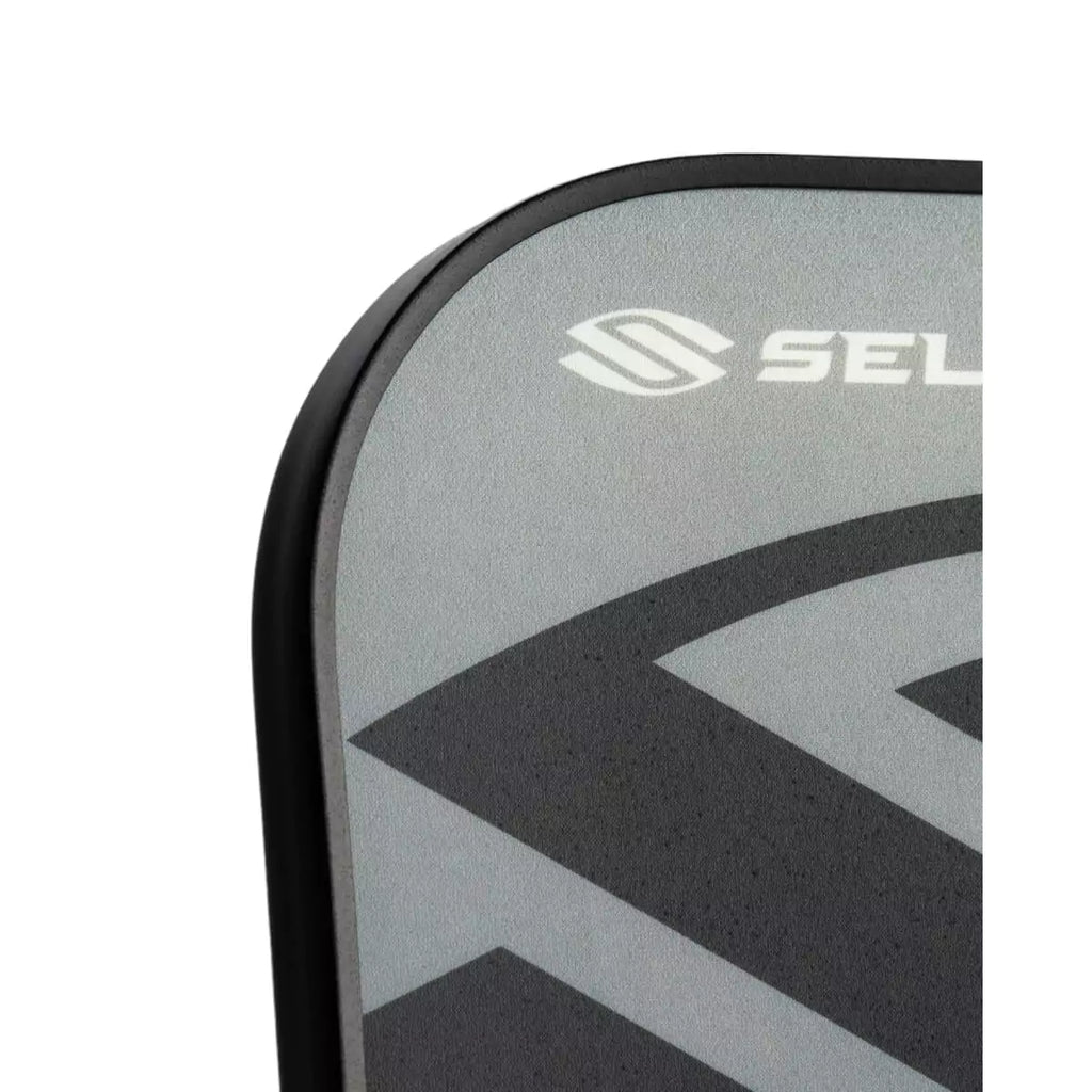 A section of the face of a gray 
Selkirk AMPED Control S2 16mm Pickleball Paddle,
FiberFlex + Fiberglass surface with 
a durable spin coating and X5 Honeycomb core.
Available from iamPickleball.store.