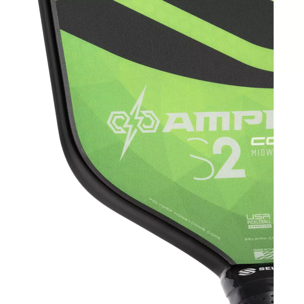 A partial view of a green 
Selkirk AMPED Control S2 16mm Pickleball Paddle,
FiberFlex + Fiberglass surface with 
a durable spin coating and X5 Honeycomb core.
Available from iamPickleball.store.