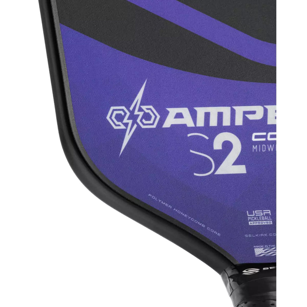 A partial view of a purple 
Selkirk AMPED Control S2 16mm Pickleball Paddle,
FiberFlex + Fiberglass surface with 
a durable spin coating and X5 Honeycomb core.
Available from iamPickleball.store.