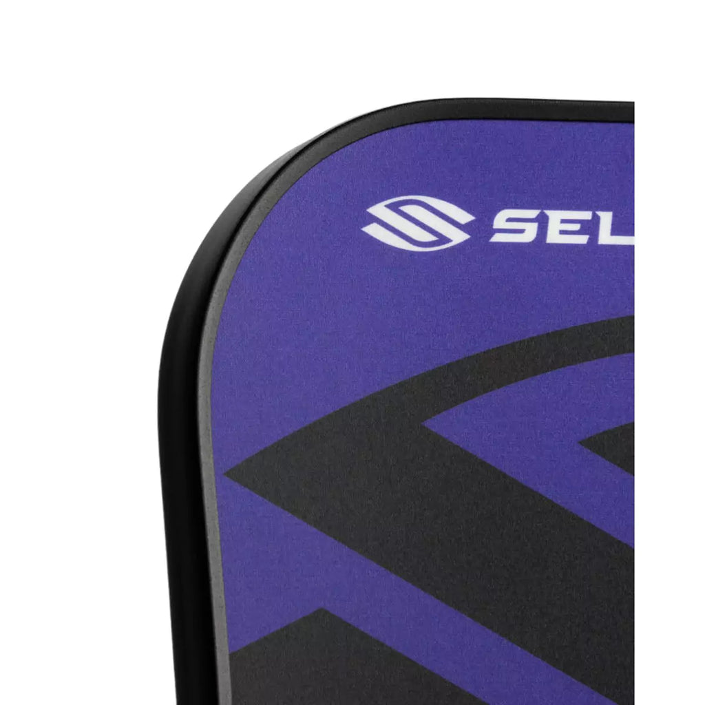 A partial view of a purple 
Selkirk AMPED Control S2 16mm Pickleball Paddle,
FiberFlex + Fiberglass surface with 
a durable spin coating and X5 Honeycomb core.
Available from iamPickleball.store.