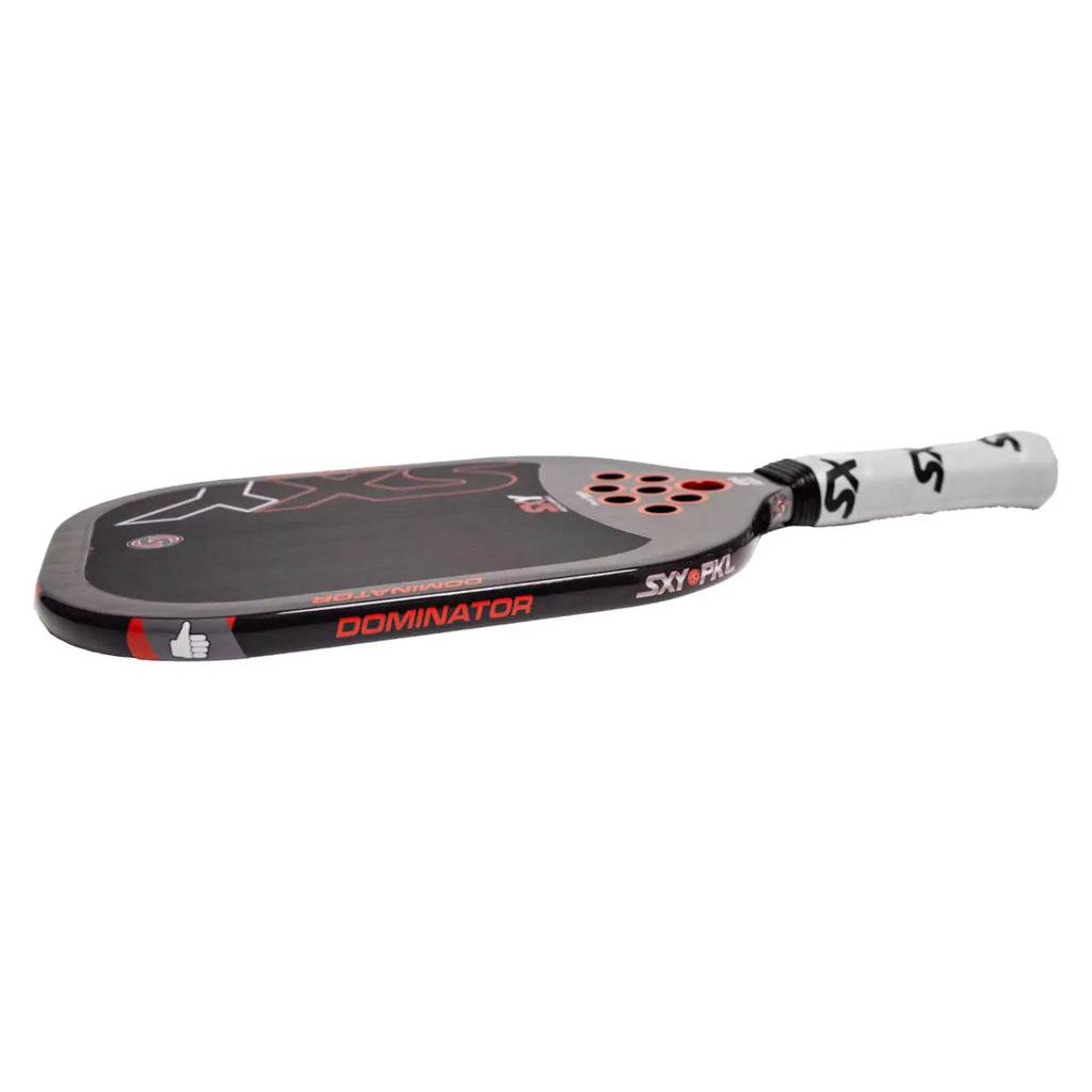 A horizontal  SXY PKL DOMINATOR Pickleball Paddle, available from iambeachtennis.com.