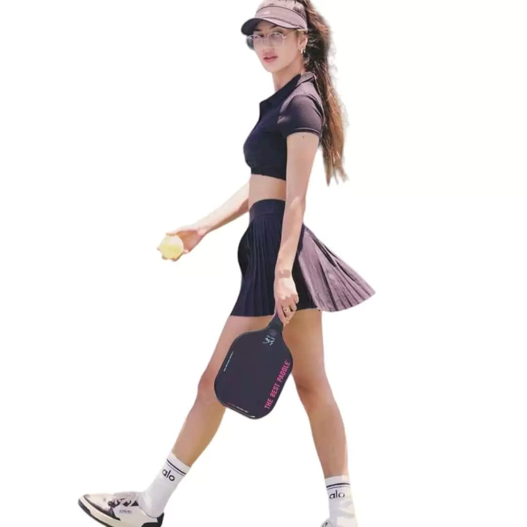 SPORT: PICKLEBALL. Shop at iamracketsports.com miami store, for "The Best Paddle". Female player striding holding a  "The Best Paddle", paddle.