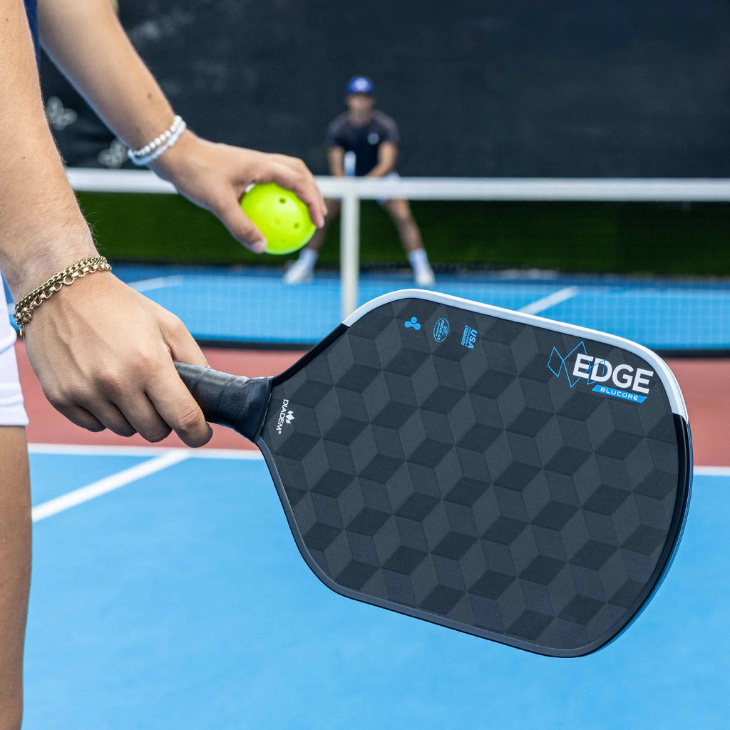 A player using a Diadem Edge Blu Core Hybrid 14 mm Pickleball Paddle, available from IamRacketsports.com, online and in-store, Miami USA.