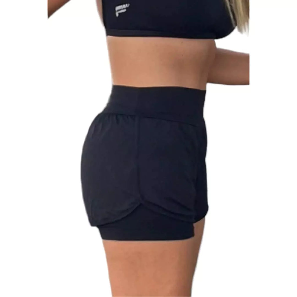 iambeachtennis BT Shop. Side view of model wearing  black Flow bondi shorts. Featuring  4-Way Premium Stretch, Sweat Wicking Fabric, Anti-Heat Cooling Comfort, Quick Dry & Smooth Hem. UV 60 Protection, Anti-Pilling fabric, and Lightweight.