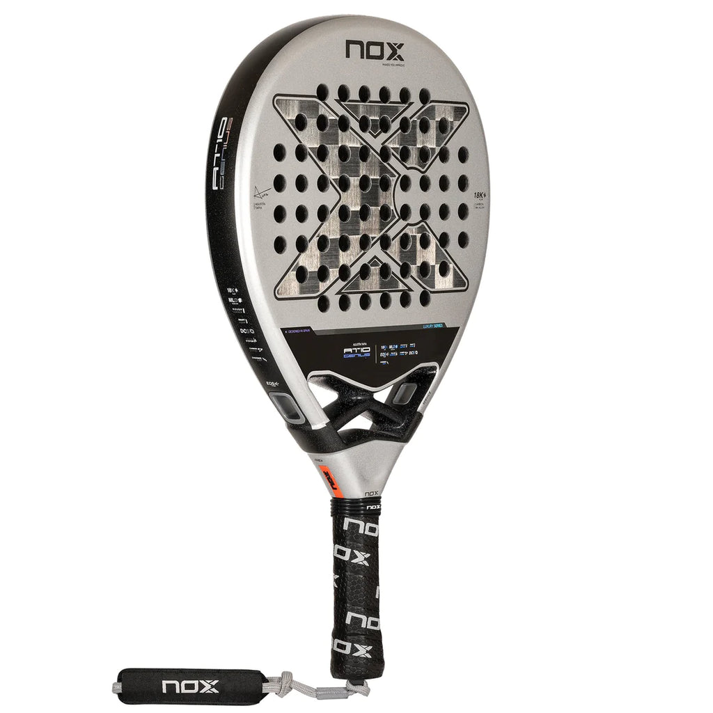 SPORT: PADEL. Shop at iampadeltennis.com for Nox.  A Nox AT10 Luxury GENIUS 18K Alum 2024 Agustín Tapia Padel, professional level racket.  Vertical rotated right, side and face profile.