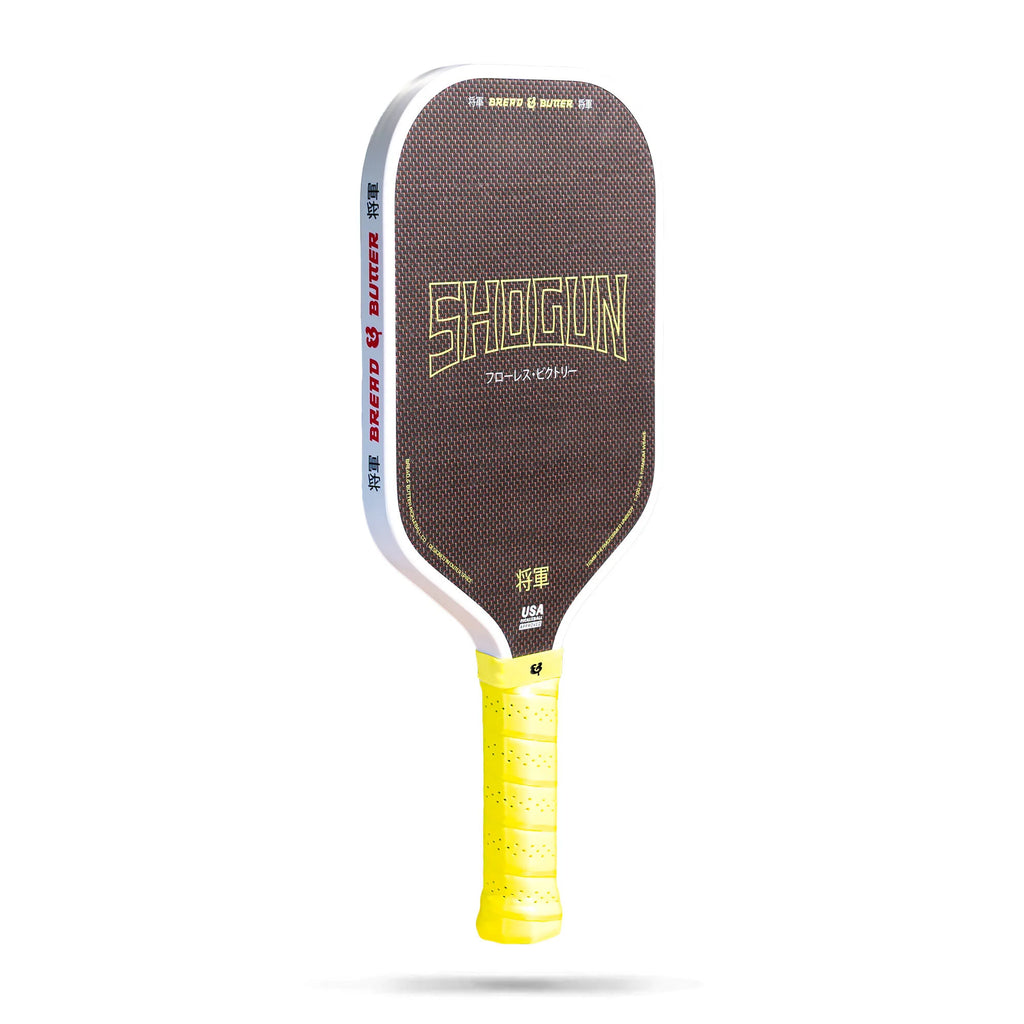 A Bread & Butter SHOGUN 16mm 2024 Elongated Pickleball Paddle, T700 Carbon Fiber and Titanium weave surface, High-Density Polypropylene core, purchase at at iamPickleball.store.