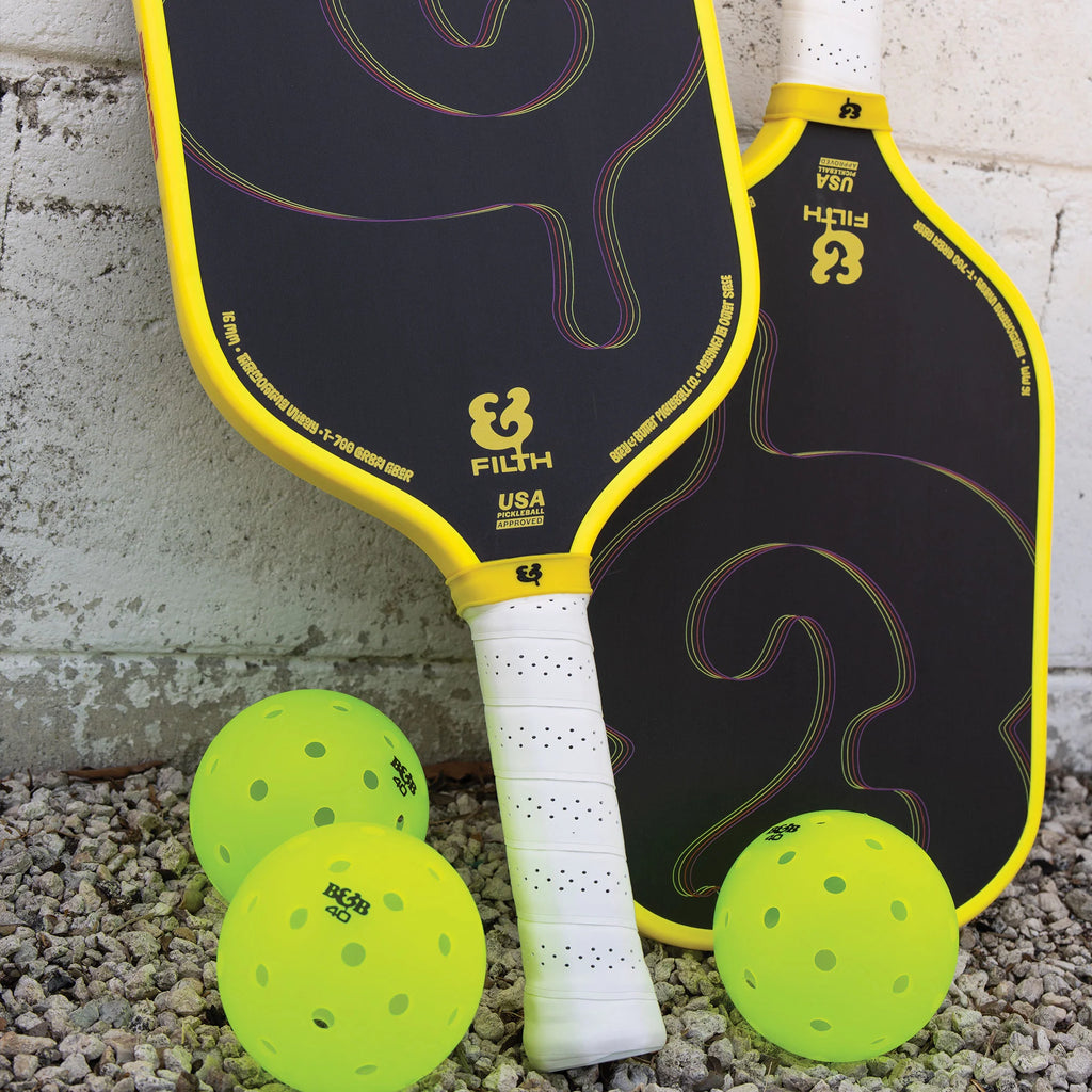 A pair of Bread & Butter Filth yellow edge guard, 16mm 2024 Elongated Pickleball Paddles,  available at iamracketsports.com, Miami shop.