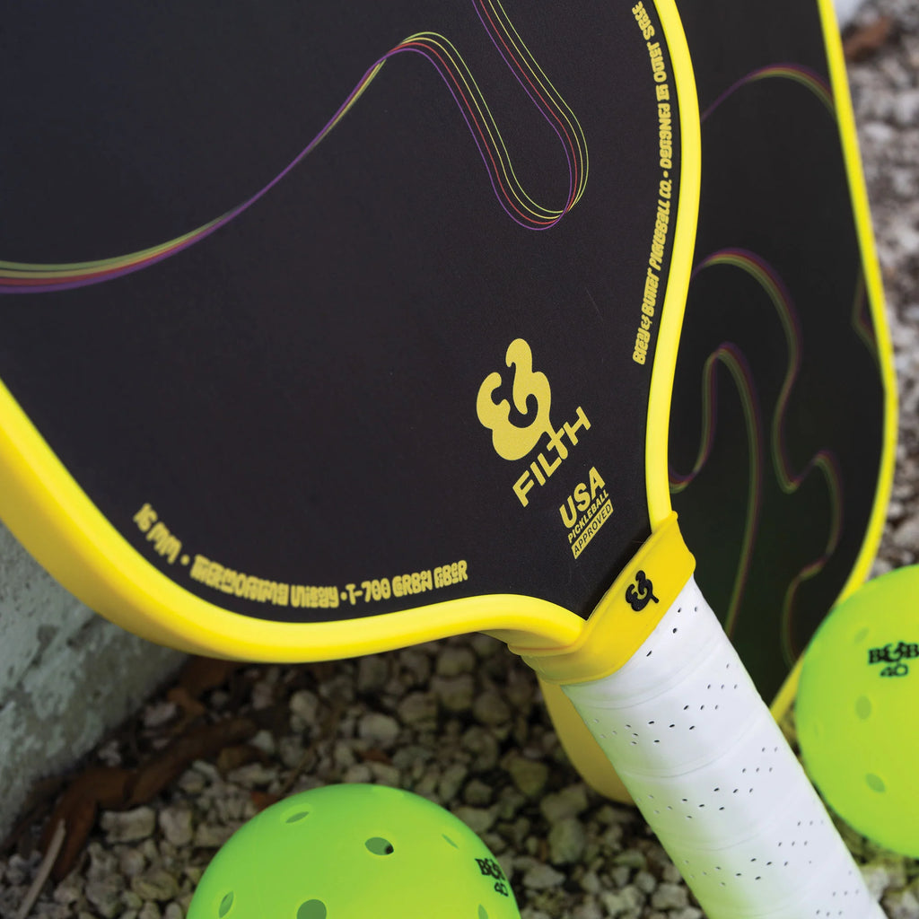 A pair of Bread & Butter Filth yellow edge guard, 16mm 2024 Elongated Pickleball Paddles,  available at iamracketsports.com, Miami shop.