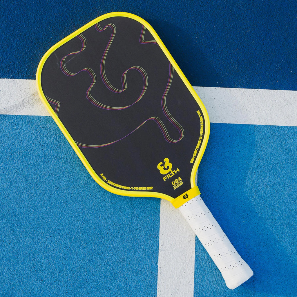 A Bread & Butter Filth yellow edge guard, 16mm 2024 Elongated Pickleball Paddle,  on court  available at iamracketsports.com, Miami shop.