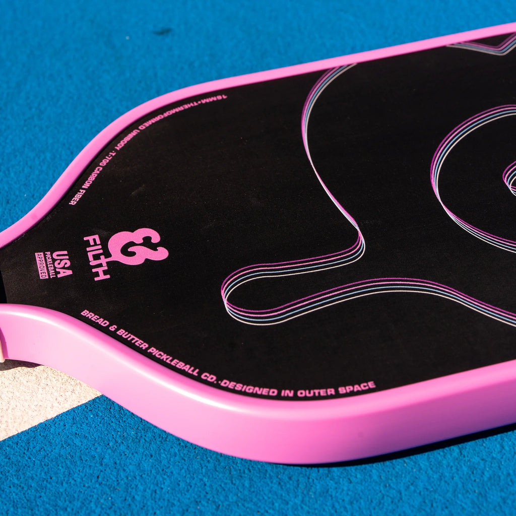 A pink  Bread & Butter SHOGUN 16mm 2024 Elongated Pickleball Paddle, available at iampickleball.store.